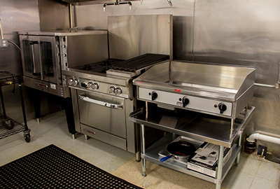 The commercial equipment on the cooking line in the Fresh Treats Bistro kitchen.