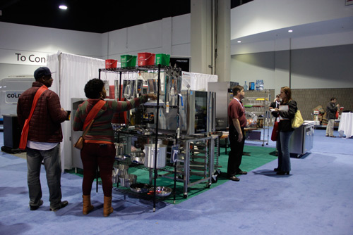 Show attendees at ACityDiscount's Booth 406 by Jeanne Stack Photography