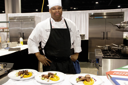 A chef-testant posing after a culinary competition at the 2015 AFSE by ACityDiscount & Jeanne Stack Photography