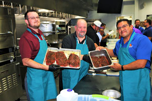 James laird and Alex Ojeda prep meat for the cooking competition