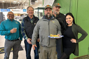 Team members enjoying food and conversation