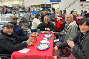 Team and friends gathered for the holiday potluck
