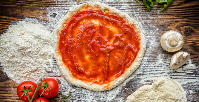 pizza dough with ingredients
